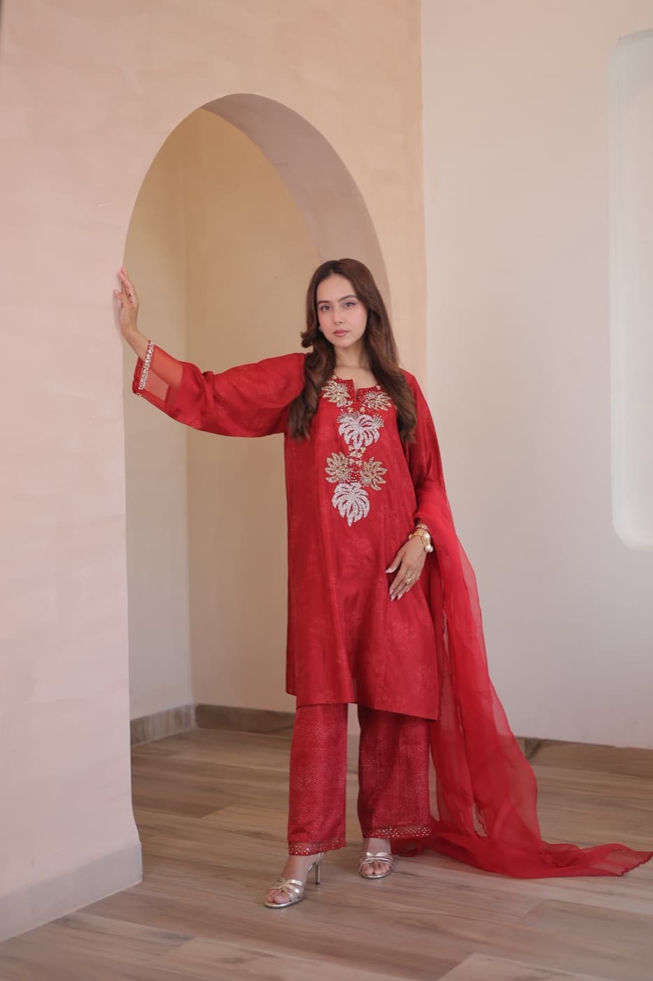 Model in crimson hand-embroidered kurta set